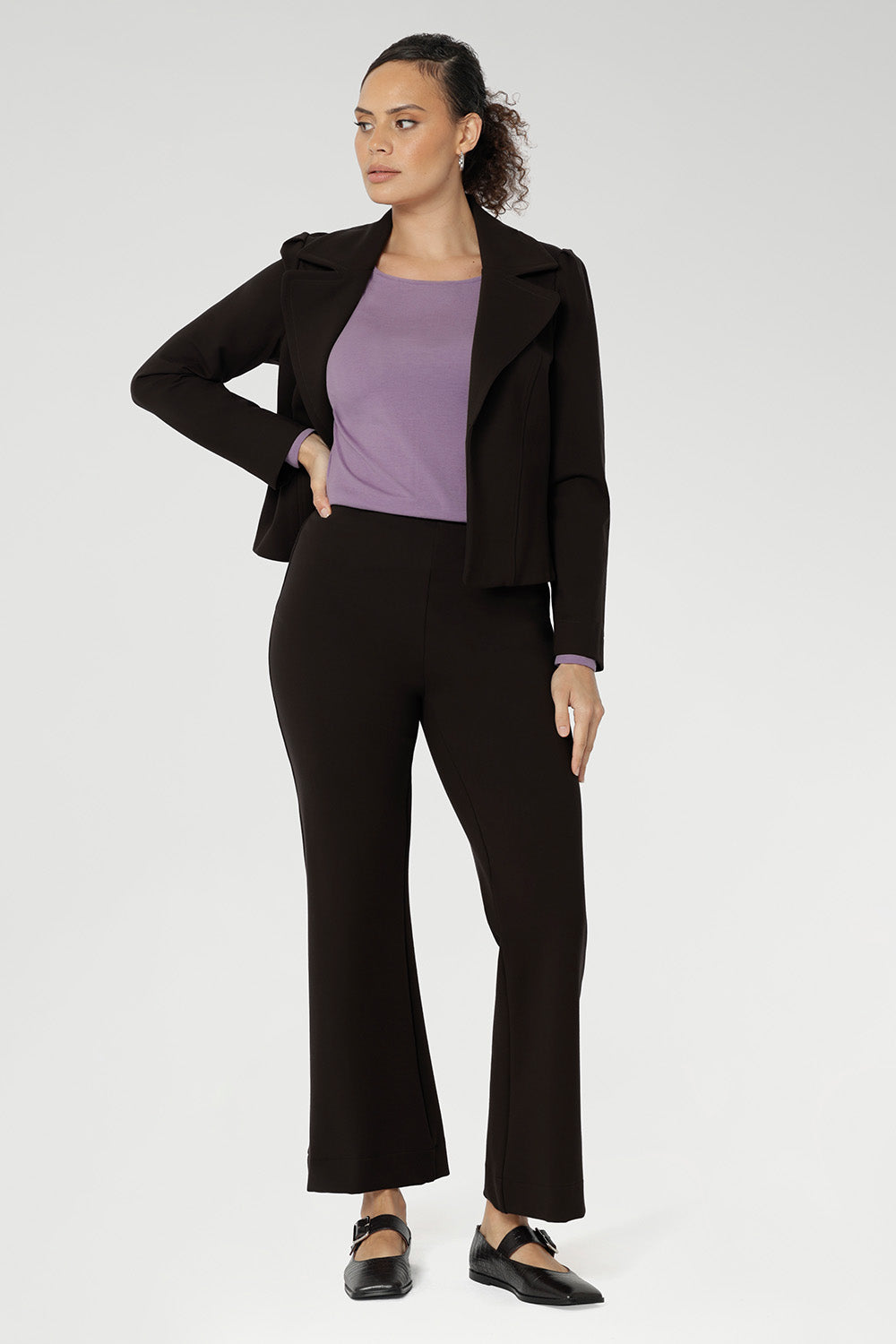 The Garcia Jacket is a modern interpretation of the classic trench, reimagined in a chic cropped silhouette. Expertly crafted from premium dry-touch Ponte jersey fabric with firm stretch, this tailored open-front jacket offers structure, comfort, and ease of movement.