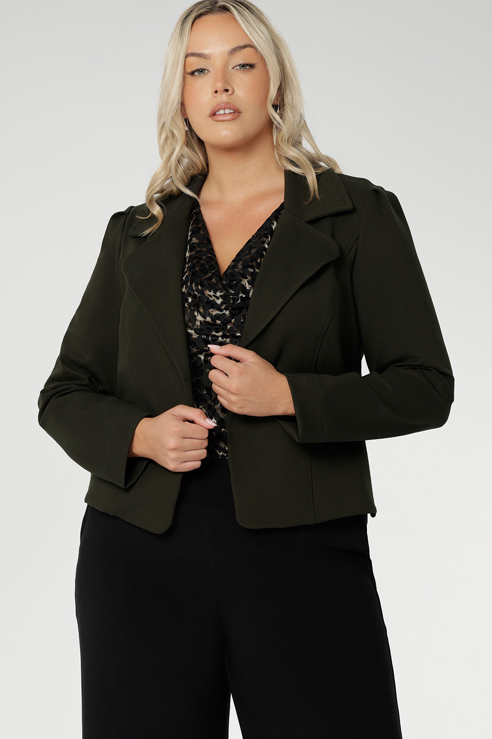 The Garcia Jacket in Olive is a contemporary take on the classic trench, reimagined in a rich, earthy tone that adds depth and versatility to your wardrobe. Crafted from premium dry-touch Ponte jersey fabric with firm stretch, this tailored, open-front jacket delivers both structure and comfort, making it an ideal layering piece for work, weekends, or travel.