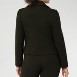 The cropped silhouette is complemented by double-layered front panels and refined collar and notch lapels, finished with subtle topstitch detailing for a sophisticated edge. A structured shoulder yoke and back darts create a flattering, contoured fit, while the full-length sleeves with gentle tucks at the sleeve heads offer a soft, elegant finish.