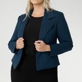 Model wears the Garcia Jacket in Petrol ponte fabric by Australian and New Zealand women's clothing brand, L&F. Featuring collar and notch lapels and long sleeves, this open-fronted jacket is good for corporate wear and casual wear.