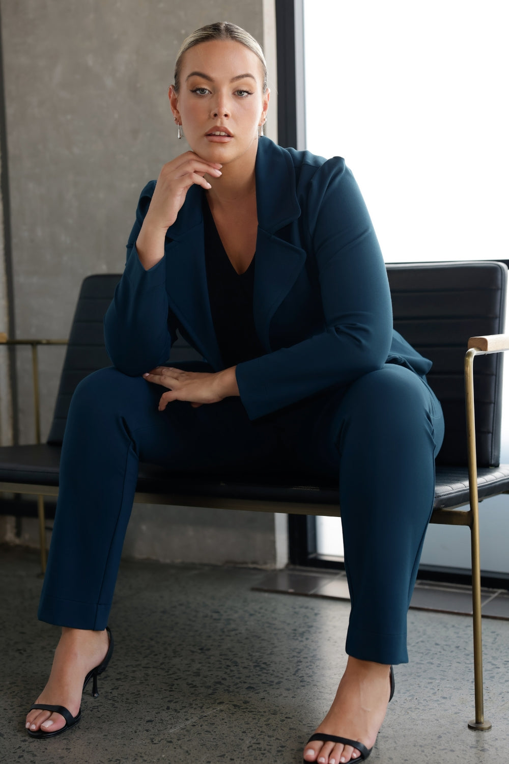 Model wears the Garcia Jacket in Petrol ponte fabric by Australian and New Zealand women's clothing brand, L&F. Featuring collar and notch lapels and long sleeves, this open-fronted jacket is good for corporate wear and casual wear.