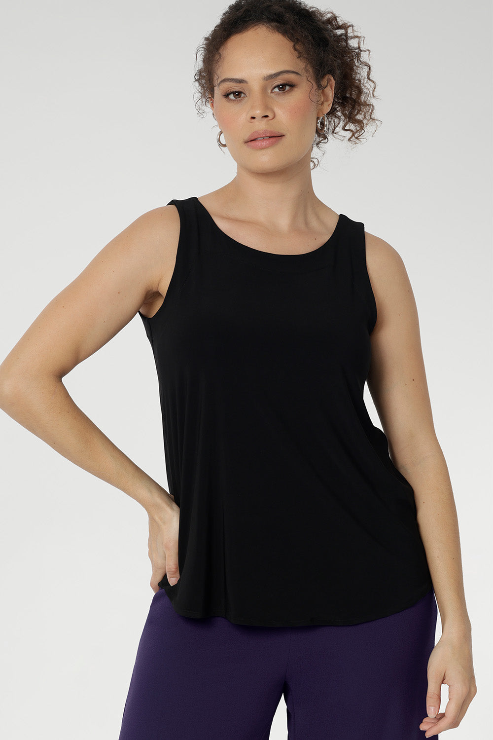 Reversible cami piece features a chic boat neckline and a sleek, streamlined silhouette that layers beautifully or shines on its own. Available in size 8-24.