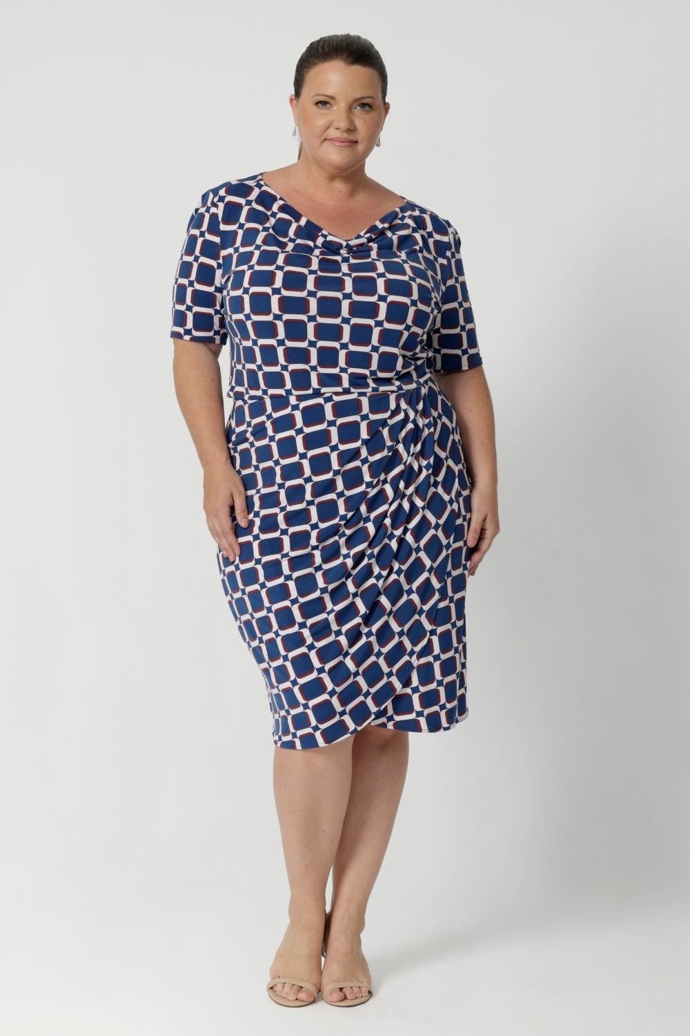 The tulip-shaped wrap skirt with tucks across the front brings an elegant flair, while the semi-fitted design provides just the right amount of structure without feeling restrictive. Plus size woman wears workwear dress is a size 18. Knee length dress is unlined, giving it a lightweight feel, wrap hemline offers a polished, professional yet feminine look that’s perfect for the office.