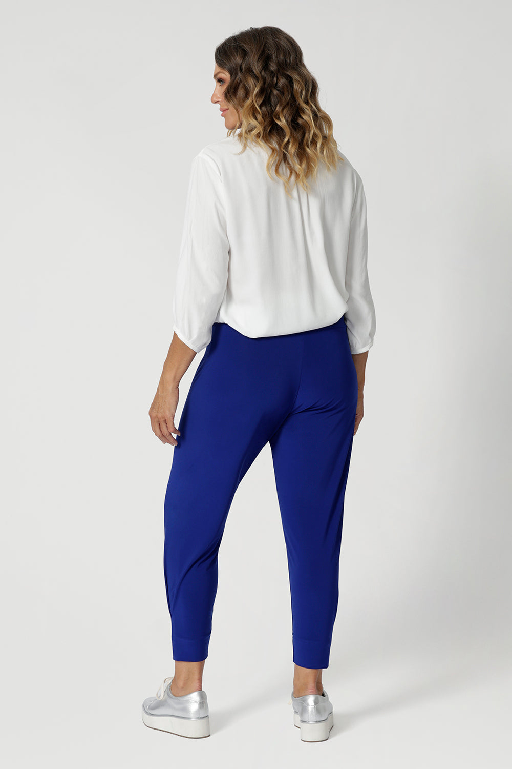 back view of wrinkle-resistant travel pants with properties that retain their crisp, smooth look throughout the day, even after long hours at the office or travel. There's no need for ironing, making them an easy, fuss-free choice for both work and leisure. Crafted with care from dry touch jersey fabric. Australian made in sizes 8-24.