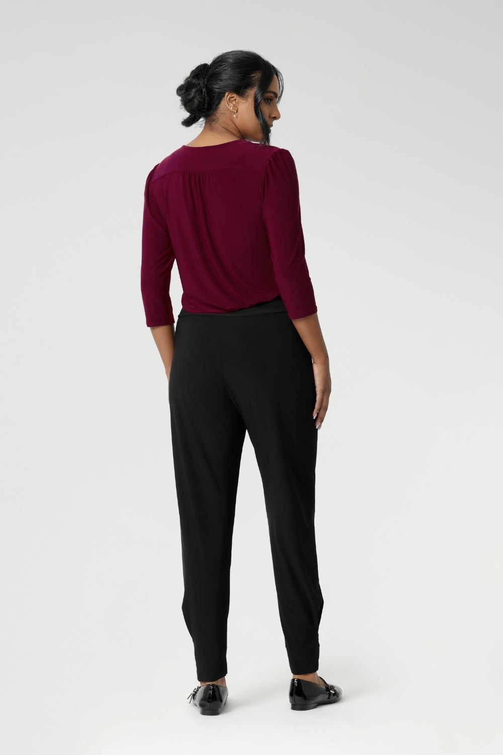 Great pants for travel, these dropped crotch, cropped leg, single seam black pants are made stretchy jersey for ultimate comfort. Shop these comfy black for your travel and capsule wardrobe now. Available in sizes 8-24.