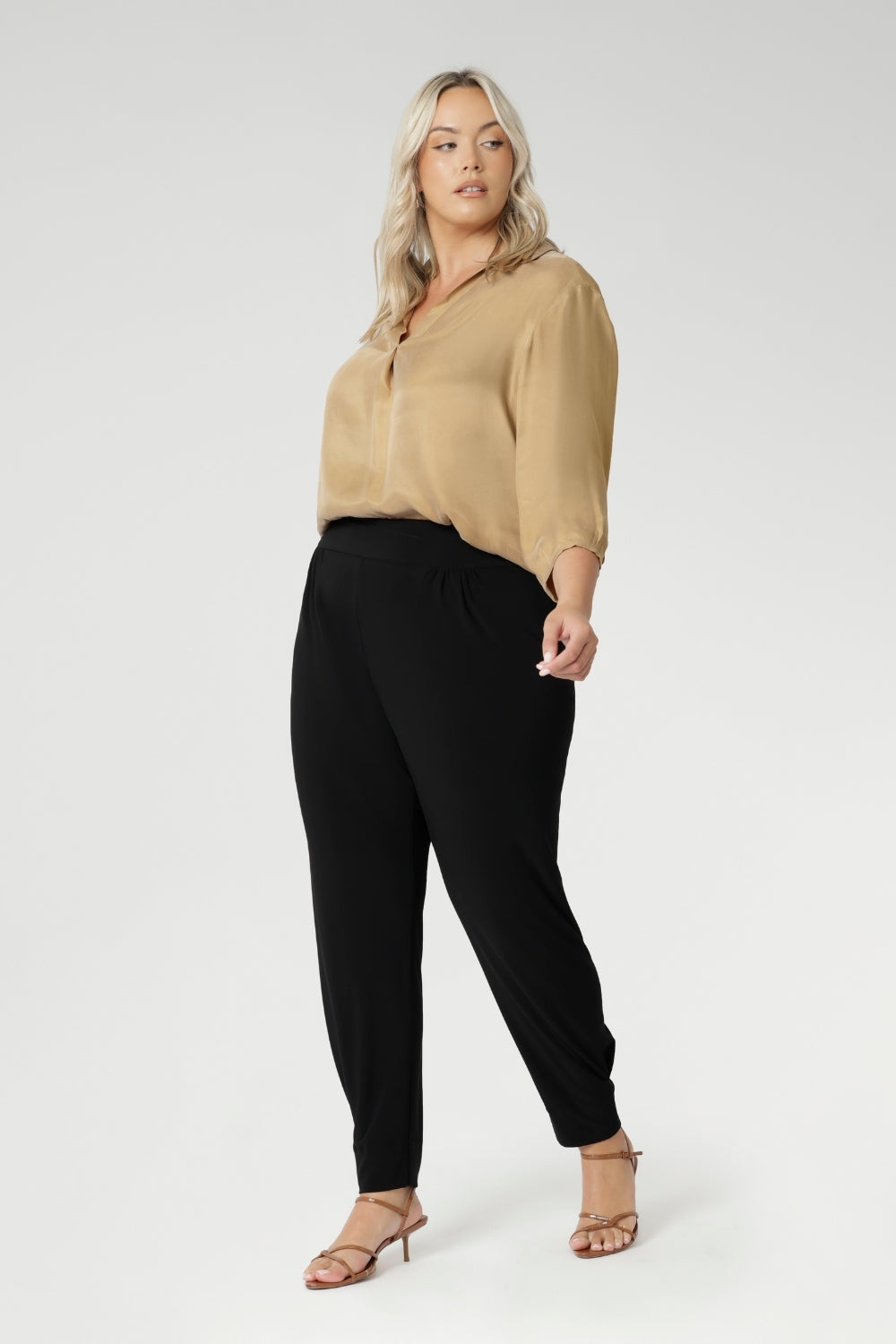 These chic 7/8 length pants feature single inside seam legs, a tapered fit, and ankle cuffs with a tuck detail, offering a sleek, modern silhouette. The Indi is the ultimate travel pant, so comfortable that you’ll want more than one pair. Perfectly versatile, it pairs effortlessly with our blazers for a seamless transition from weekend to work. Available in two different heights, designed for both plus-size and petite women.