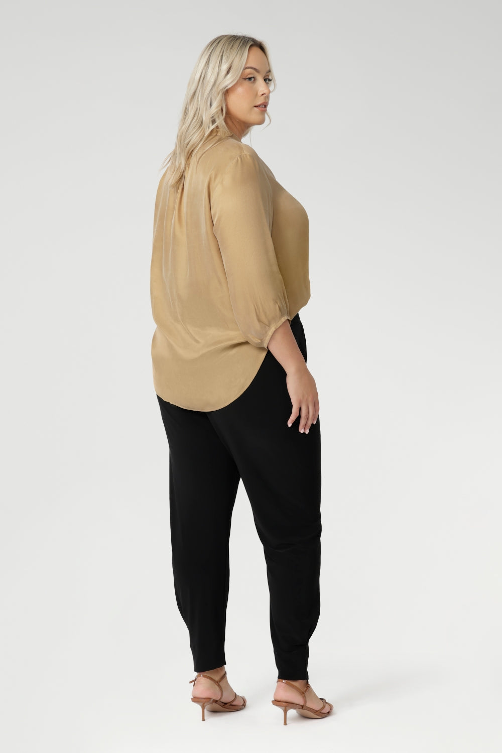 Back view of pants for travel, these dropped crotch, cropped leg, single seam black pants, shown in a size 18, are made stretchy jersey for ultimate comfort. Australian made by Australian and New Zealand women's clothing brand, L&F shop these comfy navy pants for your travel and capsule wardrobe now!