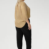 Back view of pants for travel, these dropped crotch, cropped leg, single seam black pants, shown in a size 18, are made stretchy jersey for ultimate comfort. Australian made by Australian and New Zealand women's clothing brand, L&F shop these comfy navy pants for your travel and capsule wardrobe now!