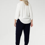 These chic 7/8 length pants feature single inside seam legs, a tapered fit, and ankle cuffs with a tuck detail, offering a sleek, modern silhouette. The Indi is the ultimate travel pant, so comfortable that you’ll want more than one pair. Perfectly versatile, it pairs effortlessly with our blazers for a seamless transition from weekend to work. Available in two different heights, designed for both plus-size and petite women.