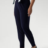 These stylish 7/8 length pants feature single inside seam legs, a tapered leg fit, and ankle cuffs with a tuck detail for a sleek, modern look.