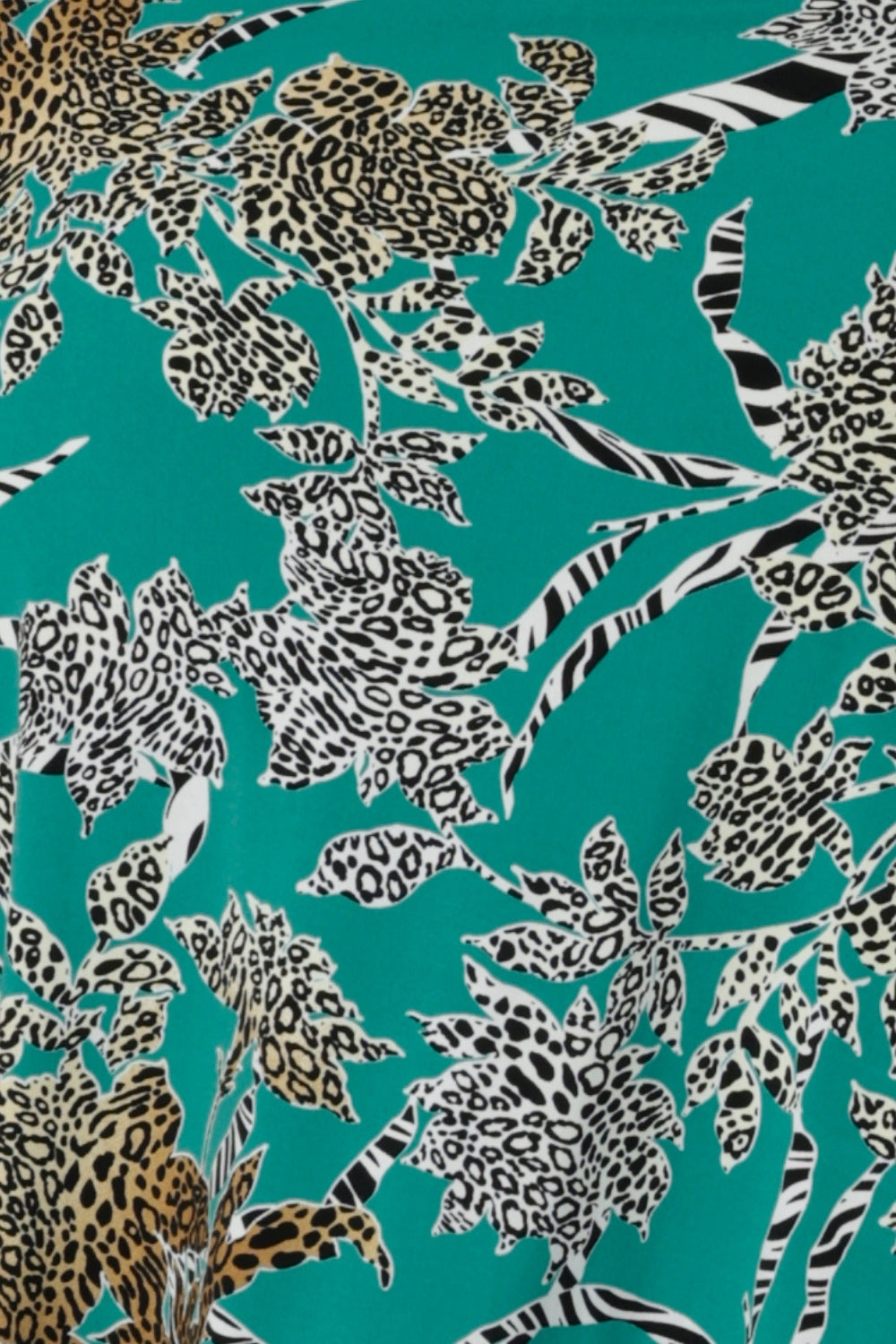 Swatch image of Jade Safari print used to create a collection of weekend and off duty garments for women in Australia and New Zealand in sizes 8-24. The Jade Safari print is on jade coloured dry touch jersey with animal print details.