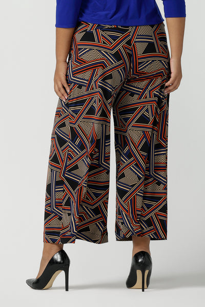 Close up of a size 16 woman wears the Dany Culotte in Trixie, a printed Jersey work pant with a geometric pattern. Wide leg with functional pockets and wide waistband. Cropped length and petite height friendly. Made in Australia for women size 8 - 24.