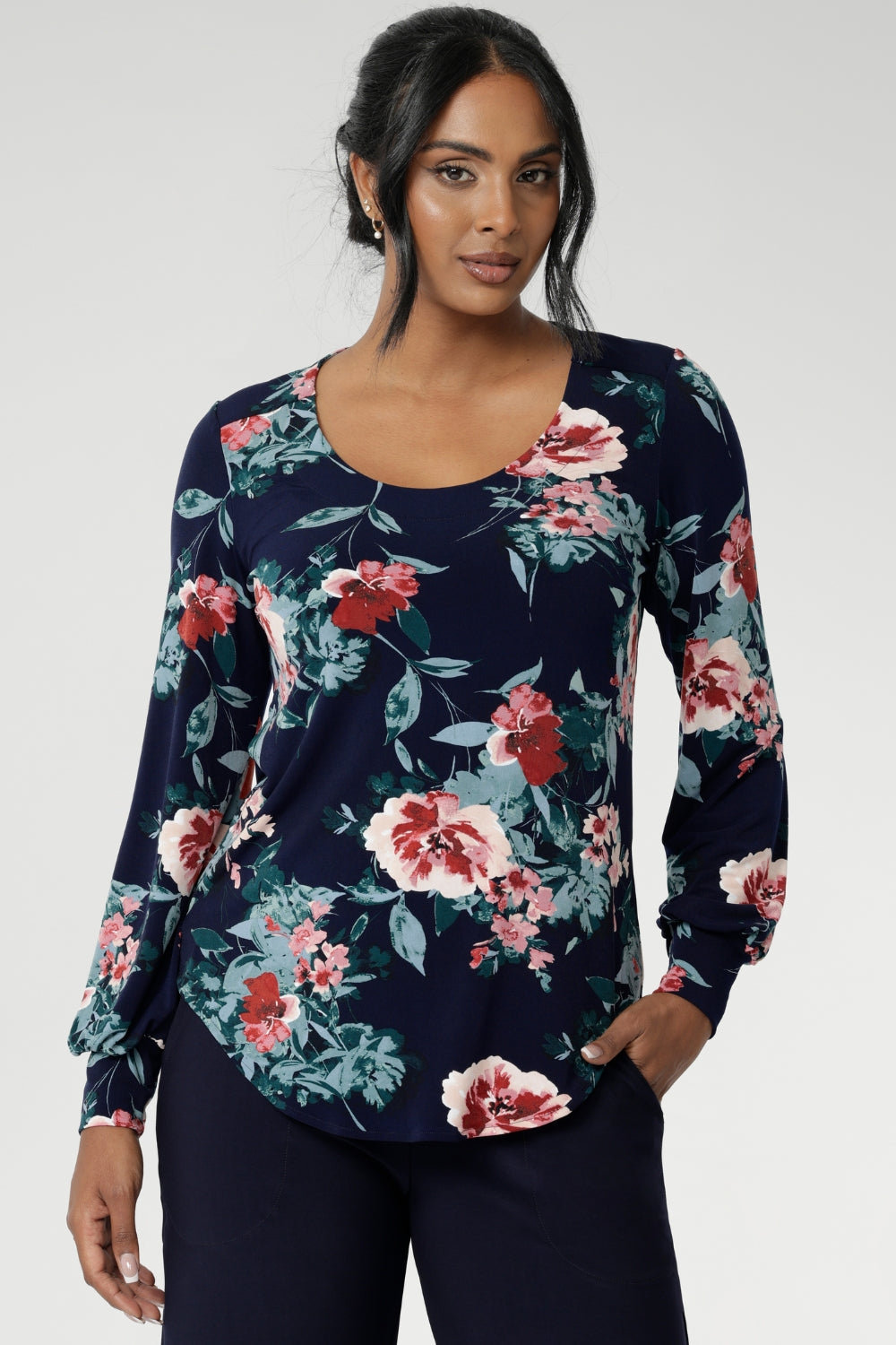 This semi-fitted silhouette features a soft scoop neckline with clean facing detail, bust darts for subtle shaping, and full-length bishop sleeves finished with a cuff that can be styled to suit your look. A classic shoulder yoke with gentle gathers at the centre back adds to the top’s fluid drape, while the shirttail hemline offers a flattering finish that looks beautiful tucked or worn loose.