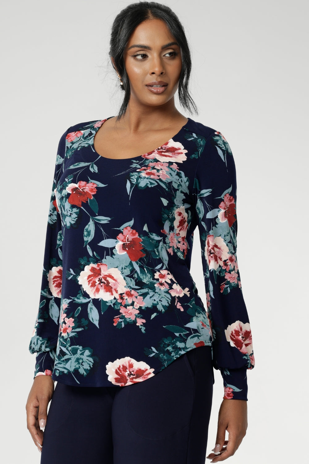 Crafted from a premium dry-touch jersey with soft stretch, the Vintage Rose print blooms across a deep navy base, with floral accents in pink, red, and blue. Designed and made in Australia for women in sizes 8 to 24, the Jasper Top brings together comfort, colour, and timeless style.
