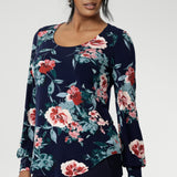 Crafted from a premium dry-touch jersey with soft stretch, the Vintage Rose print blooms across a deep navy base, with floral accents in pink, red, and blue. Designed and made in Australia for women in sizes 8 to 24, the Jasper Top brings together comfort, colour, and timeless style.