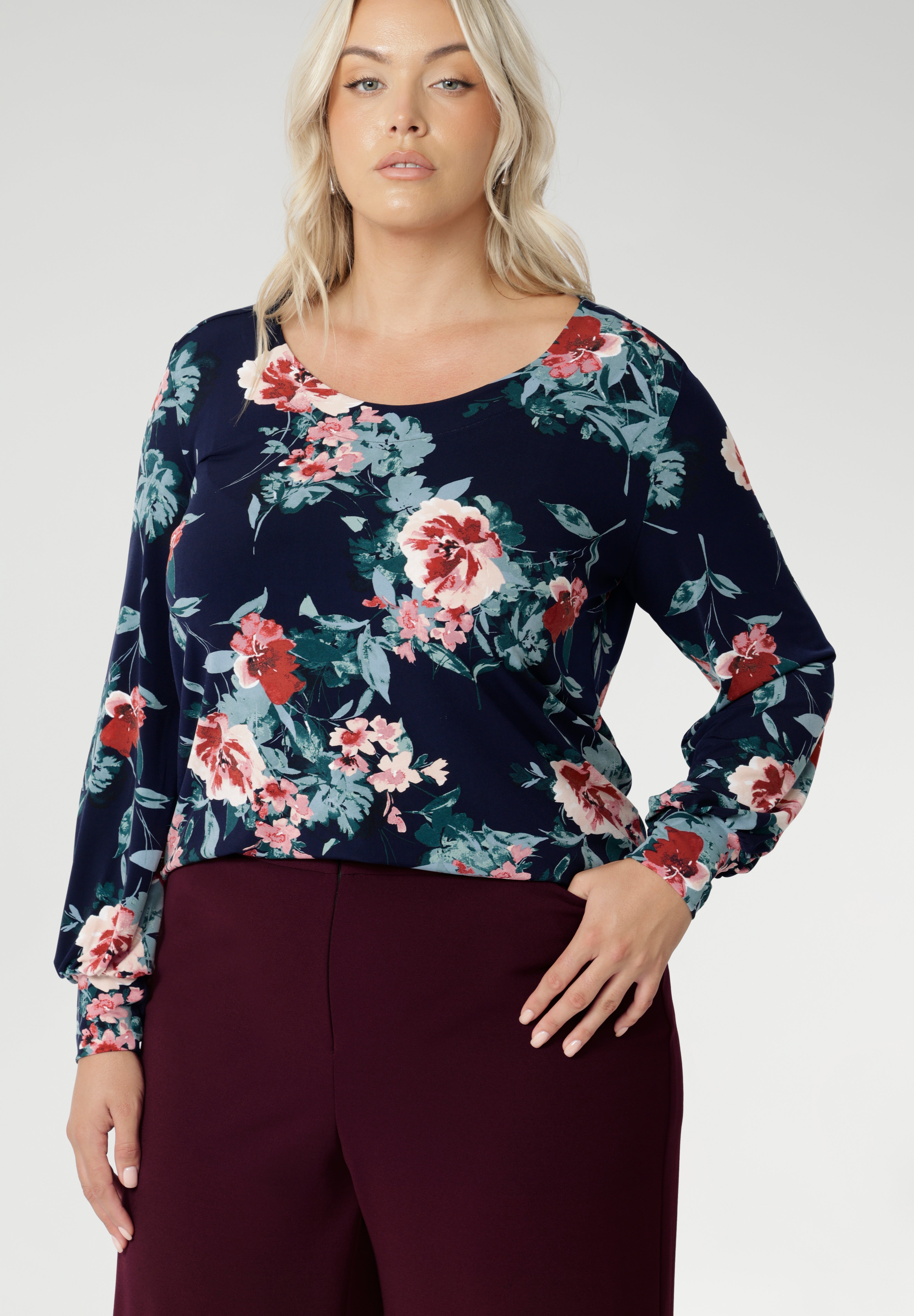 Crafted from a premium, dry-touch jersey fabric with a soft stretch, it features a beautiful Vintage Rose print set against a navy base, adorned with delicate floral accents in pink, red, and blue. Proudly Australian made and available in inclusive sizing from 8 to 24, the Jasper Top is the perfect blend of comfort, colour, and classic style
