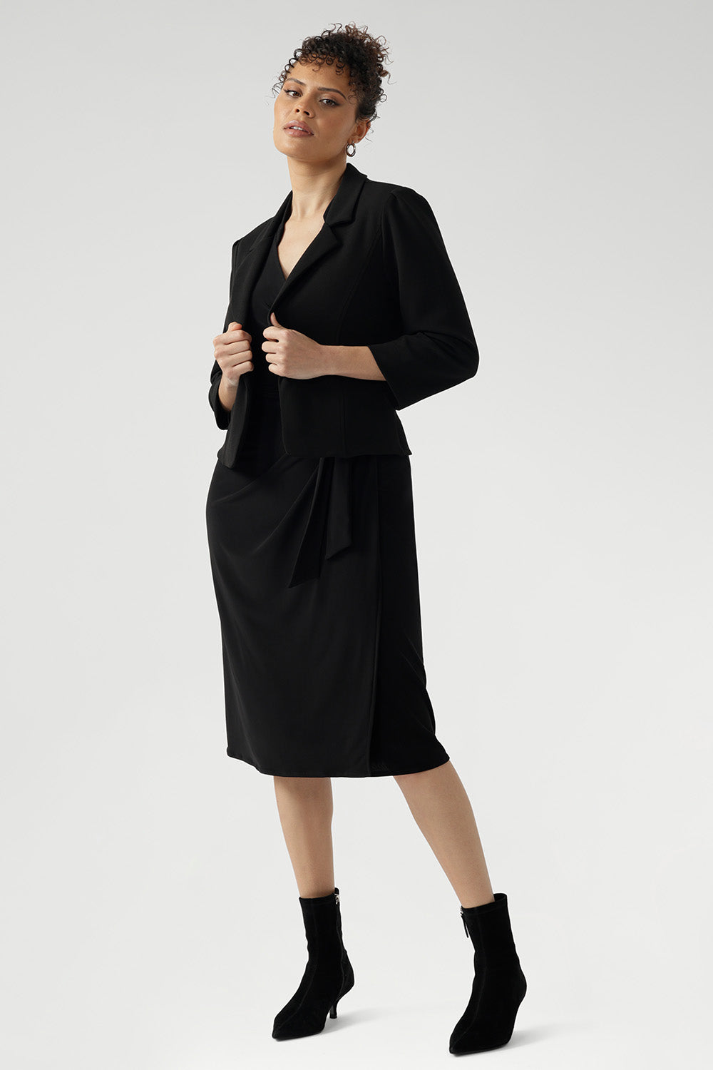 Featuring a sharp, interlined angular collar and ¾ length sleeves, the Jett Dress brings an edgy twist to classic corporate fashion, making it a standout piece in any professional wardrobe.