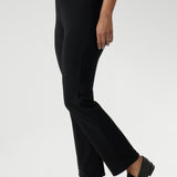The straight-leg cut is both flattering and versatile, creating a clean, tailored silhouette that works for both casual and elevated looks. Size 12 model pairs black pants with white top & silver sneakers for a casual look.