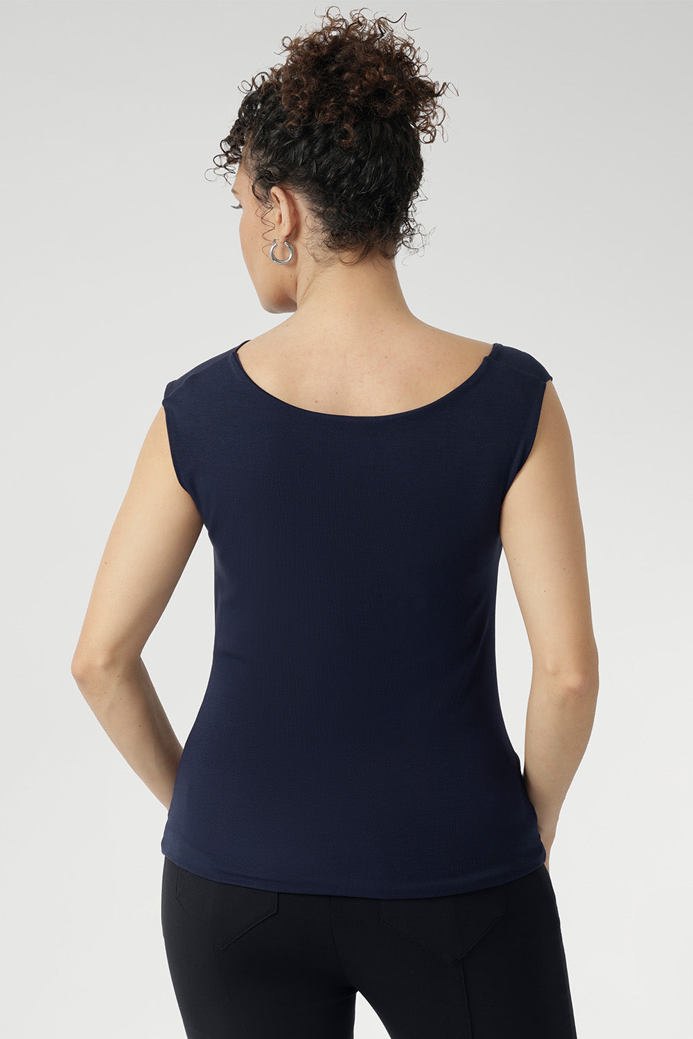 This reversible design gives you two sophisticated looks in one—wear it with the asymmetrical cowl neckline and twisted shoulder detail at the front, or reverse it for a clean boat-neckline with soft draping at the back. Featuring a double-layer front and back for a smooth, flattering fit, the Jordan Top blends modern style with timeless versatility. Proudly designed and made in Australia.