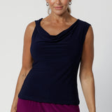 Sleeveless top can also be flipped to reveal the boat-neck style or cowl neck offering for a more open and structured silhouette. Available in navy, black and magenta. Workwear top can easily be paired with both plain pieces and prints. Available in sizes ranging from 8-24. Jordan Top is a wardrobe must-have, offering two stunning looks in one. Shop now at Leina & Fleur.