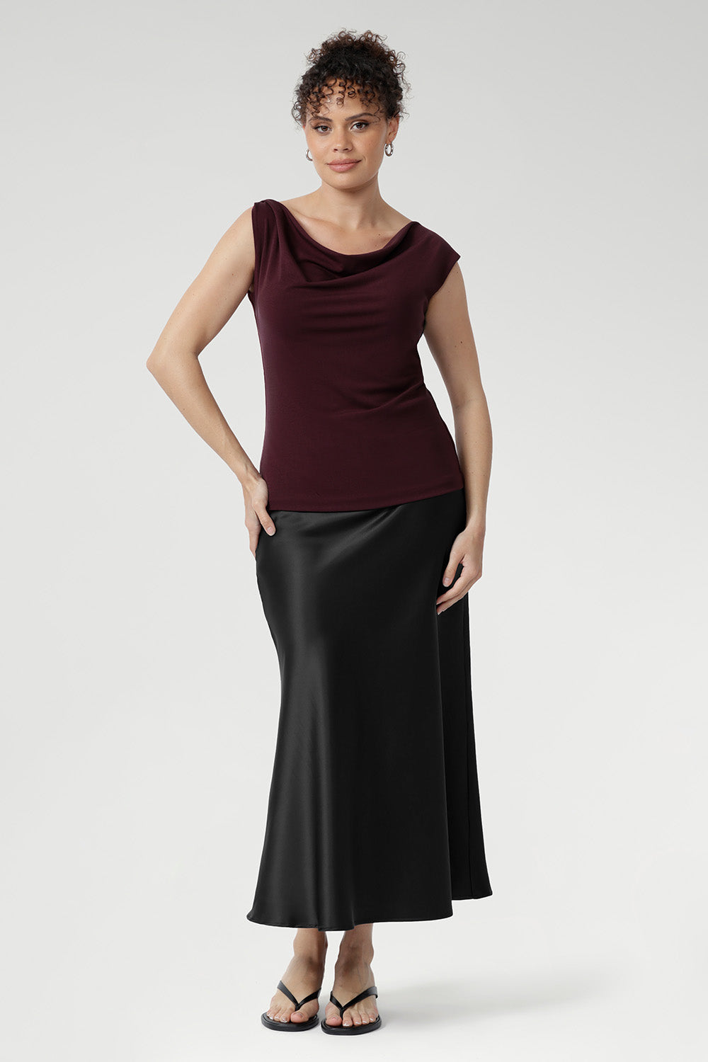 The Jordan Top provides comfortable coverage and structure. Proudly designed and made in Australia, this top combines timeless style with premium craftsmanship. Size 10 model wears her Jordan Reversible Top with black satin skirt.
