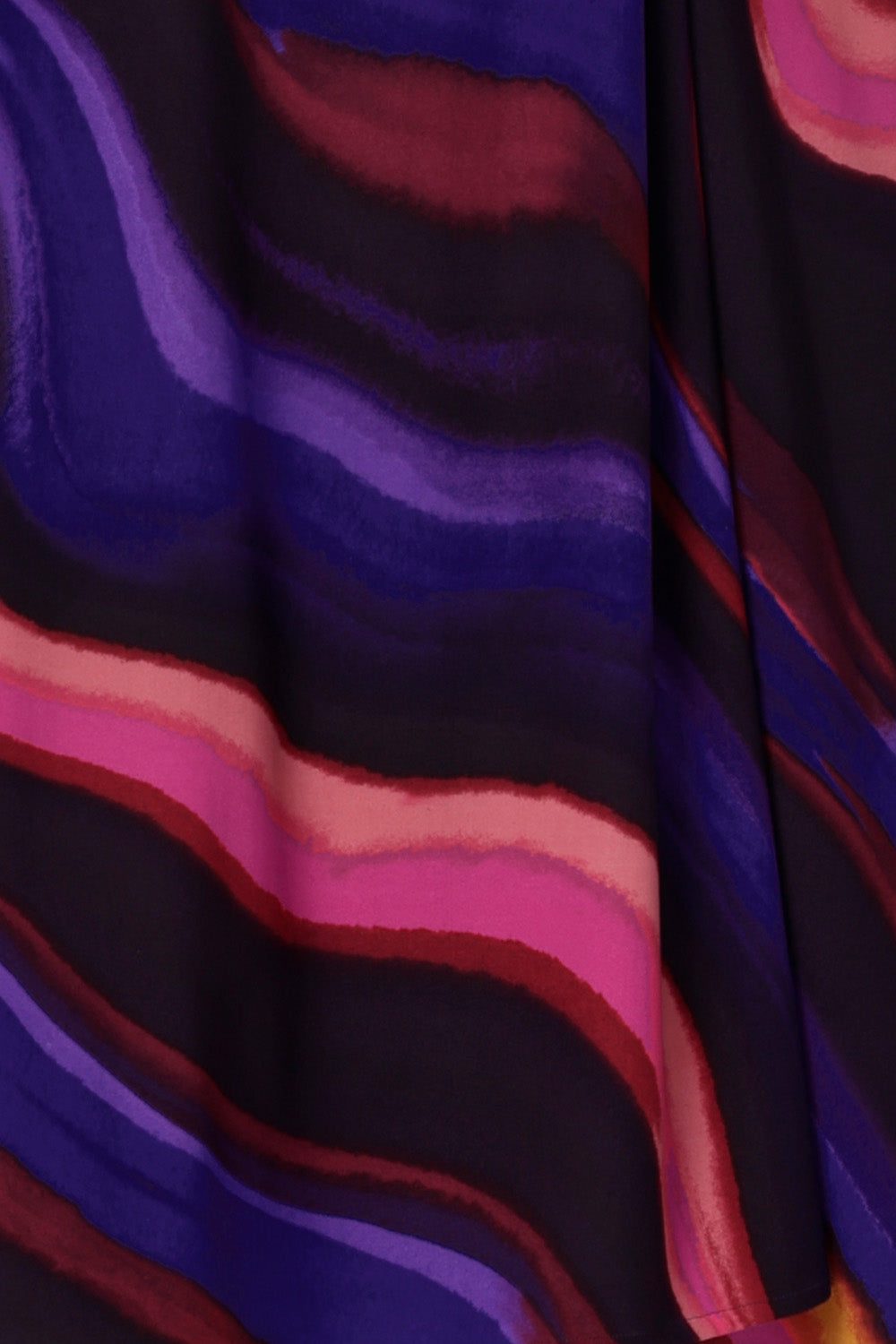 Close up swatch image of the vibrant and colourful swirly print named jupiter that was used to design an Australian Made wrap dress and fixed wrap top that brings energy and movement to every step. Crafted in our luxurious stretch jersey, these styles are available in sizes 8-24.