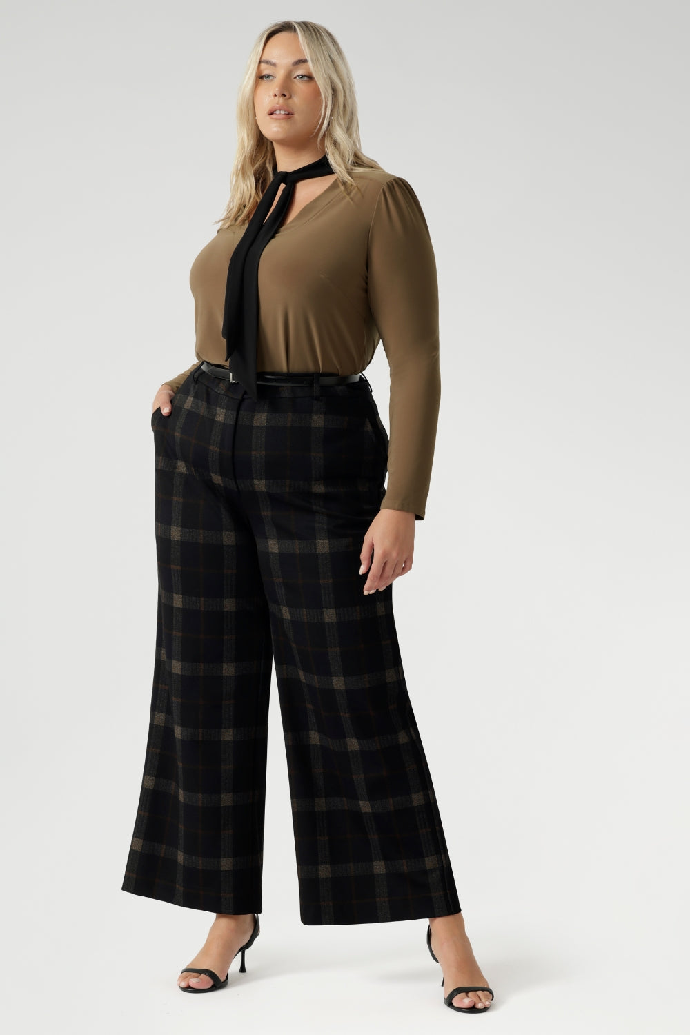 The Kade Pant brings timeless elegance with a contemporary twist, featuring a high-rise fit and full-length, wide-leg cut that flatters and elongates. A tailored waistband with a fly front and hook-and-bar closure offers a smooth, secure fit, while belt loops, back darts, and side front pockets add classic suiting details with a modern edge.