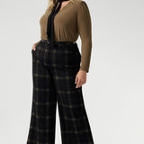 The Kade Pant brings timeless elegance with a contemporary twist, featuring a high-rise fit and full-length, wide-leg cut that flatters and elongates. A tailored waistband with a fly front and hook-and-bar closure offers a smooth, secure fit, while belt loops, back darts, and side front pockets add classic suiting details with a modern edge.