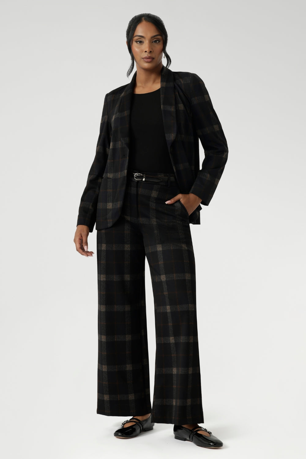The Kade Pant brings timeless elegance with a contemporary twist, featuring a high-rise fit and full-length, wide-leg cut that flatters and elongates. A tailored waistband with a fly front and hook-and-bar closure offers a smooth, secure fit, while belt loops, back darts, and side front pockets add classic suiting details with a modern edge.