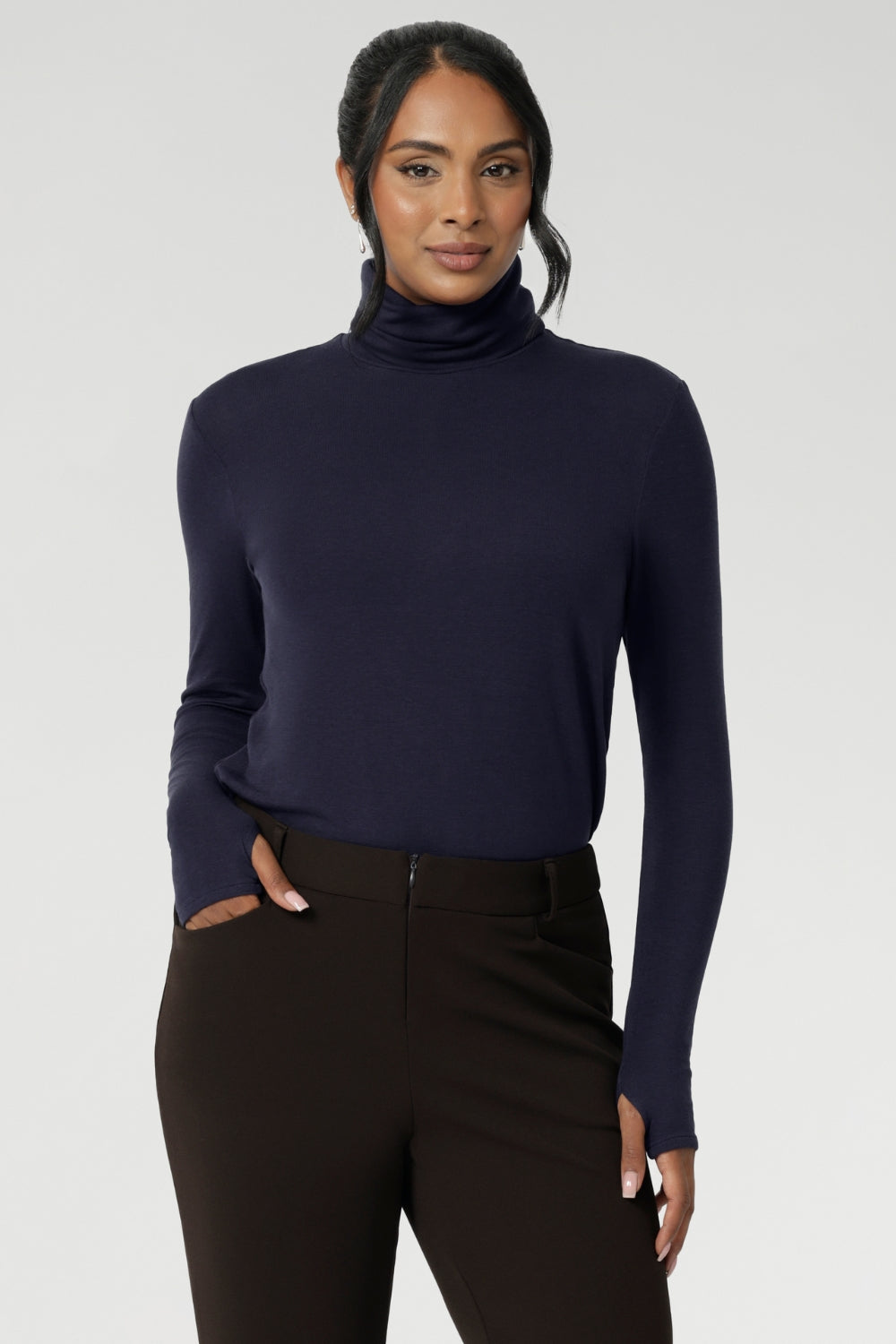 Introducing the Kean high turtleneck top from the Light Layers collection, a stylish and functional piece designed to elevate your wardrobe as the seasons cool.