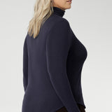 Introducing the Kean high turtleneck top from the Light Layers collection, a stylish and functional piece designed to elevate your wardrobe as the seasons cool. This long-sleeved top features convenient thumb holes for added comfort and warmth. Crafted from lightweight, warm tencel wool fabric.