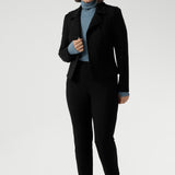 Introducing the Kean high turtleneck top from the Light Layers collection, a stylish and functional piece designed to elevate your wardrobe as the seasons cool. This long-sleeved top features convenient thumb holes for added comfort and warmth. Made from a blend of stretchy Tencel wool fabric, it offers both flexibility and coziness, making it the perfect layering piece for cooler weather.