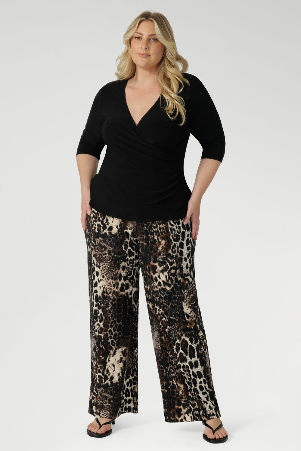 Transitions seamlessly from desk to dinner with the Kyle Top in Black. It's the ideal combination of professional polish and all-day comfort, a must-have for any modern wardrobe. Available in sizes 8-24.