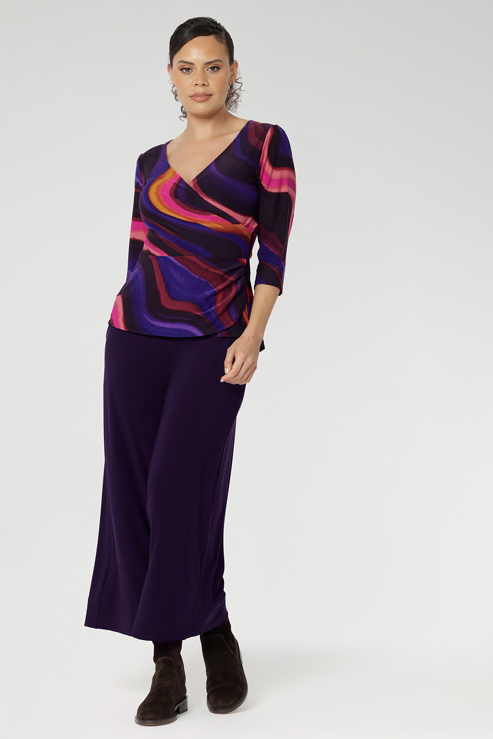 Kyle features a soft peplum waist seam enhances the silhouette with subtle structure and femininity. Wear it loose for a graceful drape or tuck it into high-waisted pants for a more defined, office-ready look.