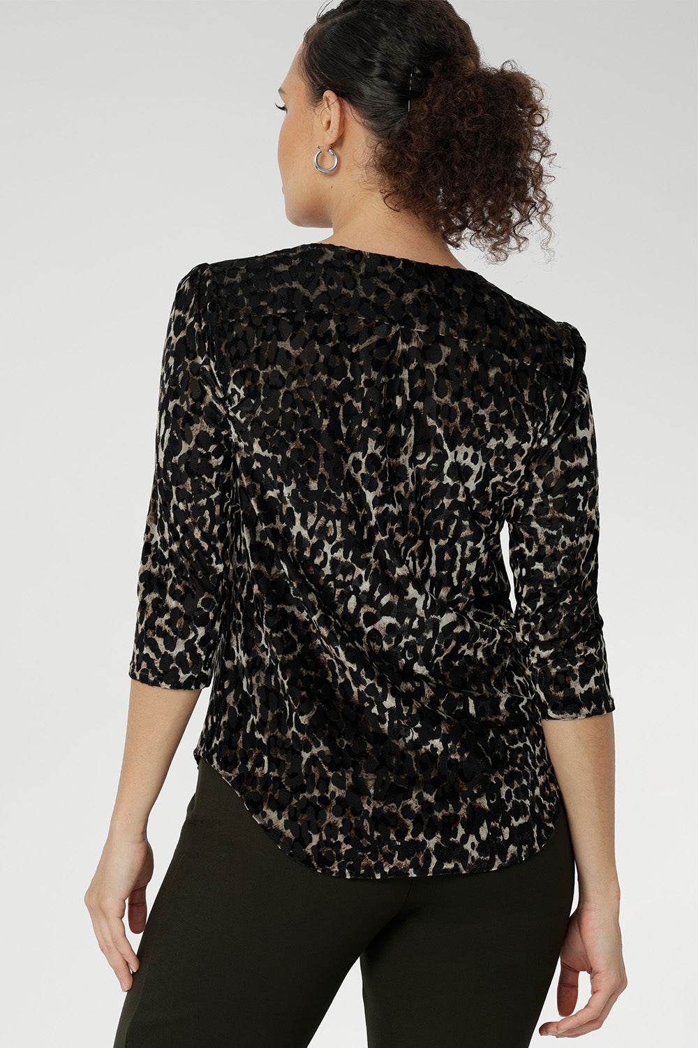 The striking animal print, set against a soft, stretch velour base in warm golden tones, brings depth and richness to the design, while the light sheerness offers a hint of texture and dimension