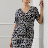 Elevate your wardrobe with the Leah Dress, expertly crafted from our signature dry-touch stretch jersey that delivers all-day comfort with a polished finish. Designed for seamless transitions from the office to evening events and weekend outings, this versatile dress features a flattering fixed wrap bodice, a sophisticated knee-length tulip skirt, and above-elbow sleeves that strike the perfect balance between coverage and style.