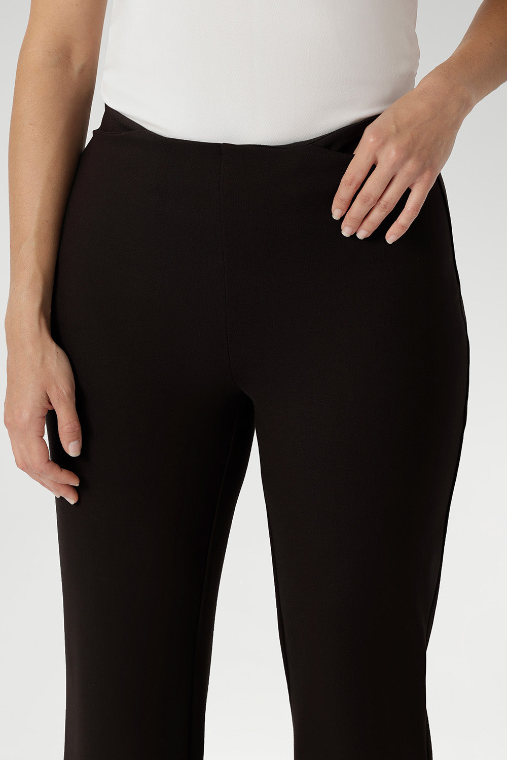 ide pockets with refined topstitch detailing add a polished, practical touch, while the deep cocoa shade pairs effortlessly with neutrals, prints, or bold colours for versatile styling. Proudly designed and made in Australia.