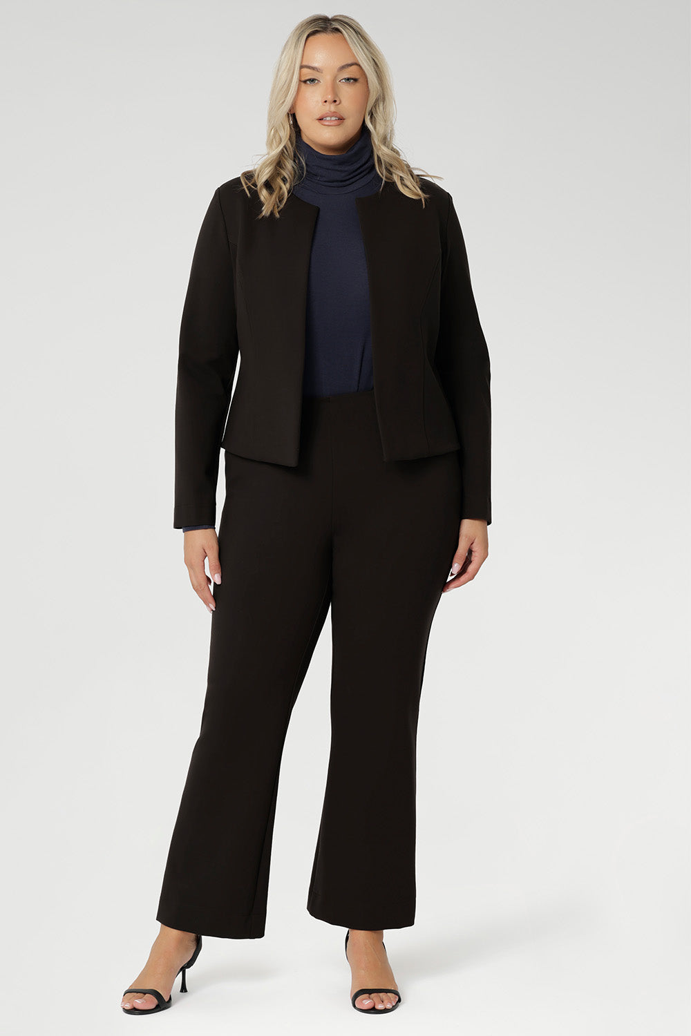 Elevate your wardrobe with the Lesley Bootcut Pant in Cocoa, a rich, earthy tone that brings warmth and sophistication to any outfit. Crafted from premium dry-touch Ponte jersey fabric with firm stretch, this sleek pull-on pant is designed to offer structure, comfort, and style all day long.