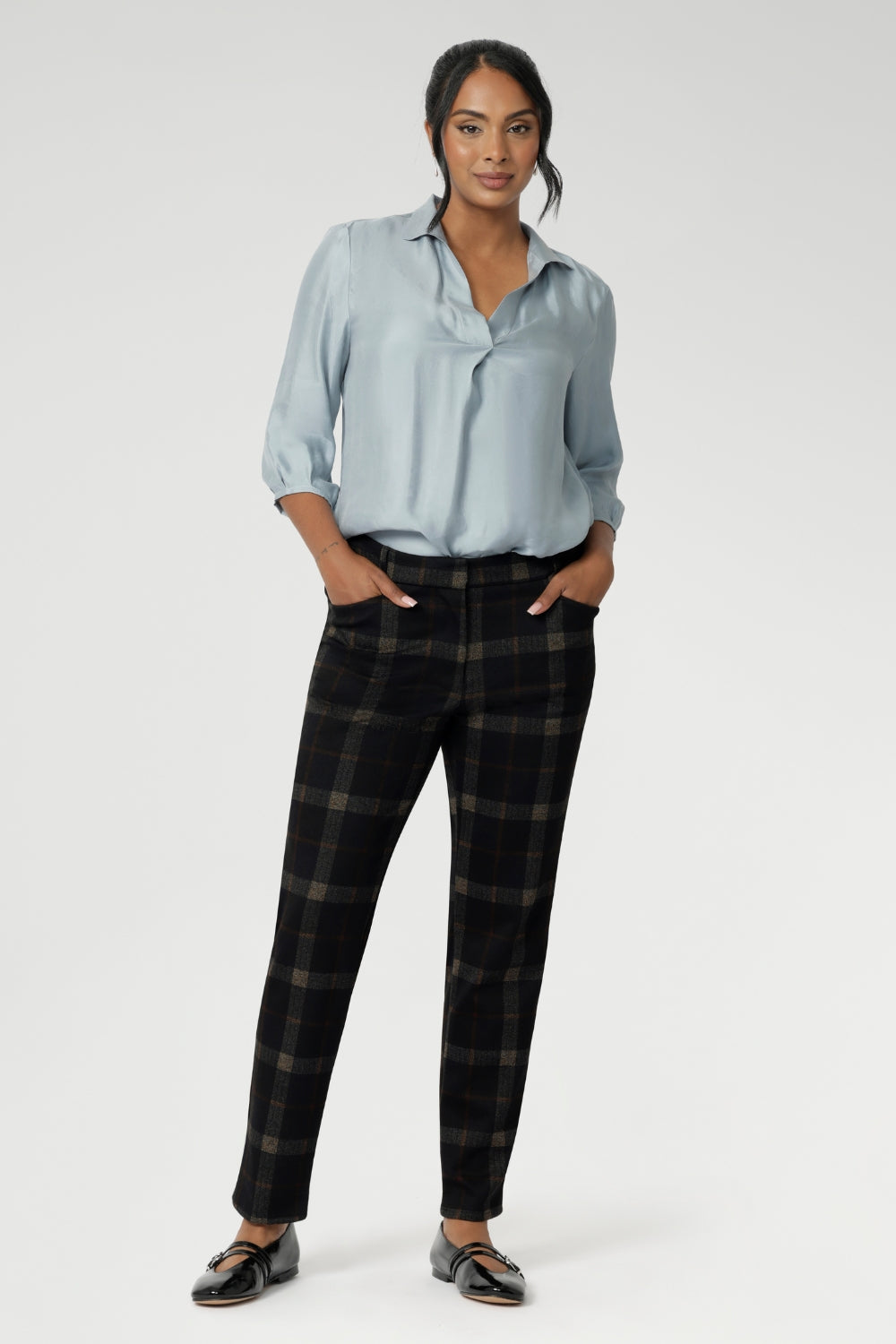 The Lulu Pant, a contemporary take on classic tailoring. With a mid-rise fit, slim tapered leg, and ankle-length finish, the Lulu brings a sleek, modern edge to both workwear and smart-casual styling. The tailored waistband features a fly fastening with a hook and bar closure for a clean front, while angled front pockets, back darts, and belt loops complete the look with refined detail.