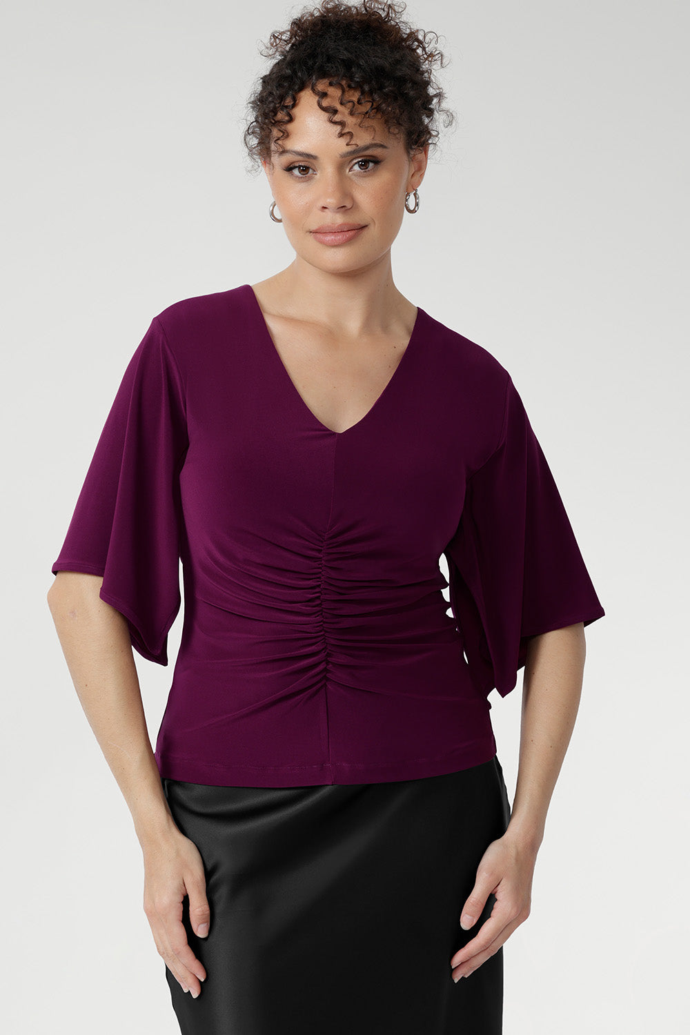 Crafted from our signature dry-touch stretch jersey, the Luna Top is designed with professional style and all-day comfort in mind, featuring handkerchief sleeves, and a stylish V-neckline that adds sophistication.