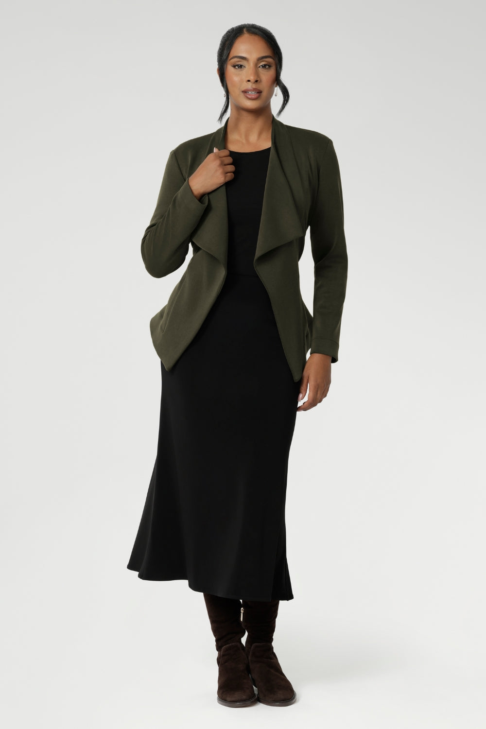 Size 10 model wears Dark Olive jacket over black scoop neck top and black midi work wear skirt. Available in size 8-24. Lyndon is a perfectly versatile piece, it pairs effortlessly over dresses or with L+F separates for an elevated work to weekend attire.
