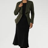 Size 10 model wears Dark Olive jacket over black scoop neck top and black midi work wear skirt. Available in size 8-24. Lyndon is a perfectly versatile piece, it pairs effortlessly over dresses or with L+F separates for an elevated work to weekend attire.