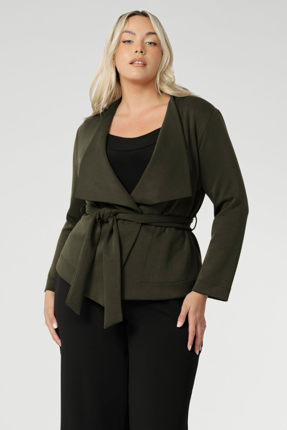 Size 18 model wears Dark Olive jacket over black work top and black wide leg pants. Available in size 8-24. Lyndon pairs effortlessly over dresses or with L+F separates for an elevated work to weekend attire, perfect for the cooler months.