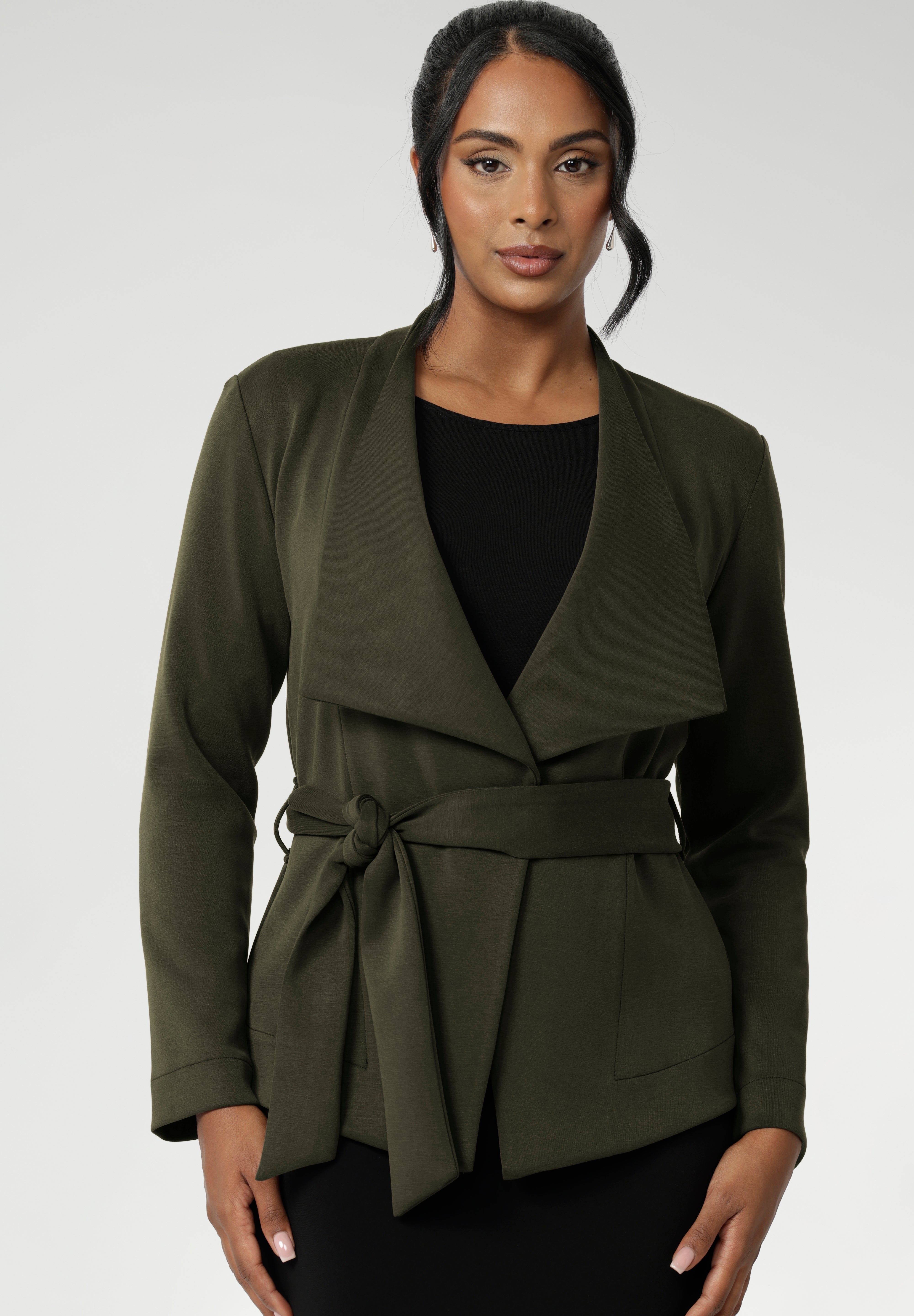 Crafted in a flattering wrap silhouette, this piece showcases double-layered, angled front panels for a contemporary touch. It includes a detachable waist tie and belt loops, giving you the option to wear it open or cinched to highlight your shape. Available in sizes 8 to 24.