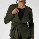 Designed with both comfort and sophistication in mind, Lyndon features a flattering wrap silhouette that can be worn open for a relaxed look or cinched at the waist with its coordinating tie for a more defined shape.