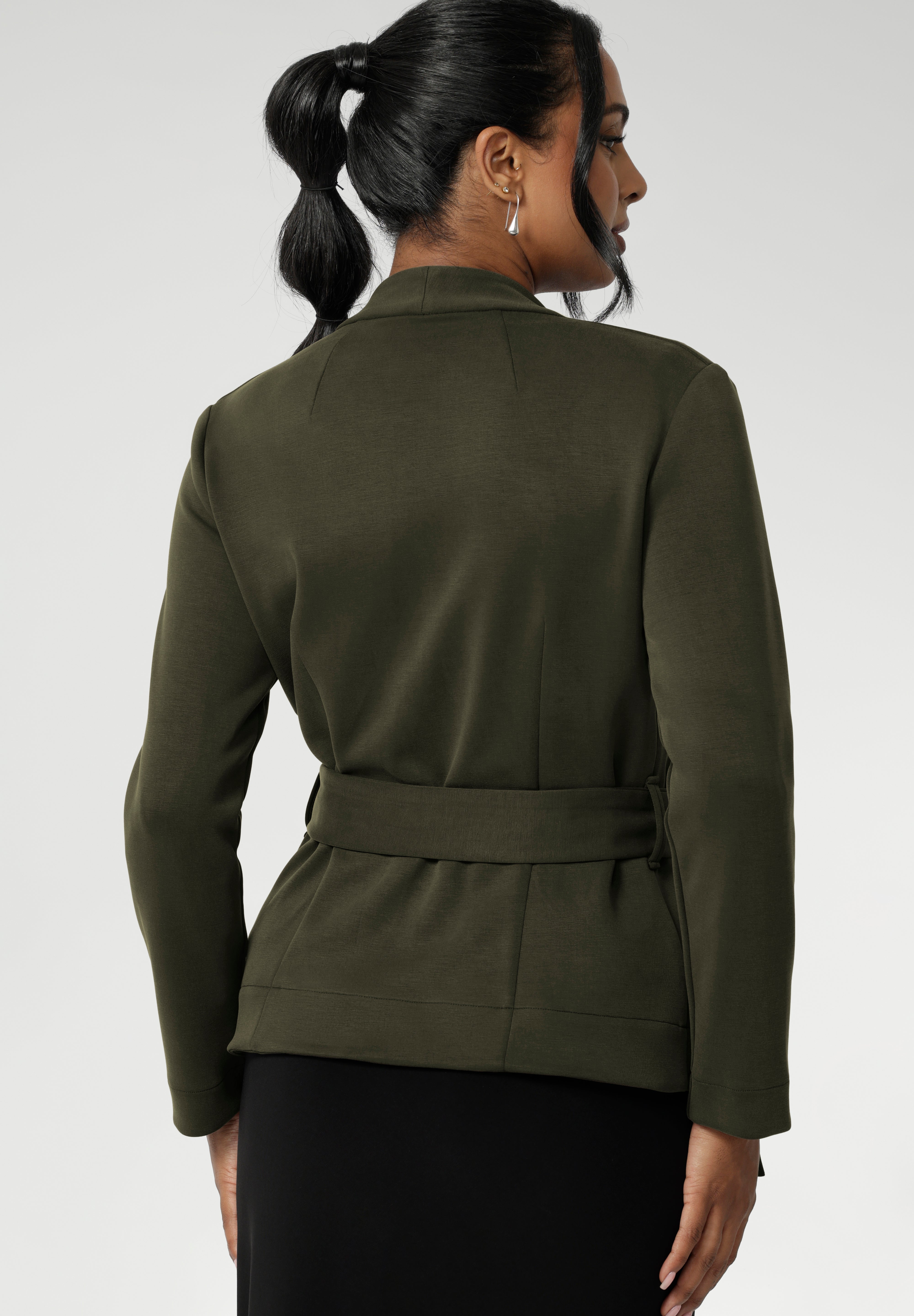 Lyndon features a double-layer jacket with angled front panels for a modern edge and a detachable waist tie with belt loops, allowing you to wear it open or cinched to define your silhouette. Available in size 8-24. Perfectly versatile, it pairs effortlessly over dresses or with L+F separates for an elevated ensemble.