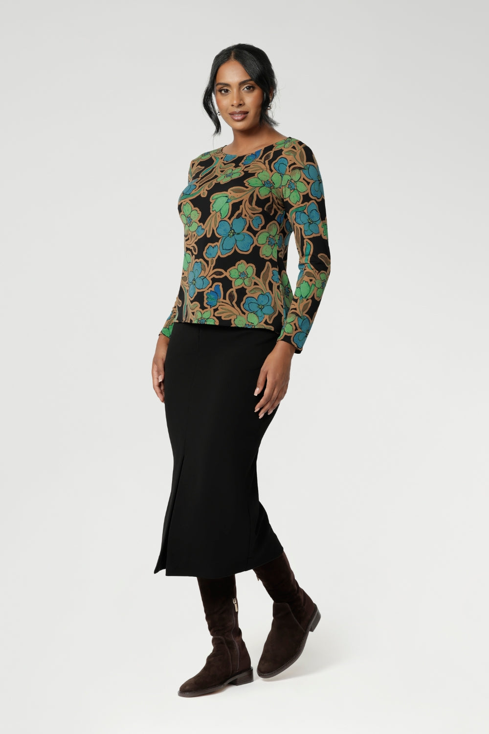 The long sleeves provide added warmth, while the straight hemline at the front and curved hemline at the back, which sits longer, give it a modern touch. Available in sizes 8-24, this top is Australian Made, ensuring quality and craftsmanship. It’s a versatile piece that will effortlessly elevate your everyday wardrobe.