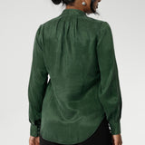 Crafted from suede touch Tencel that has a luxurious feel and drape. Proudly made in Australia in sizes 8-24. The Matisse Shirt in Deep Green is a pull-on style with a tie neckline, crafted from soft, fluid fabric. Blouson sleeves and buttoned cuffs add a polished finish. Matisse is a semi-fitted pull on style V-neckline shirt with extended neck ties, back pleats and bishop sleeves.