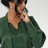 Crafted from suede touch Tencel that has a luxurious feel and drape. Proudly made in Australia in sizes 8-24. The Matisse Shirt in Deep Green is a pull-on style with a tie neckline, crafted from soft, fluid fabric. Blouson sleeves and buttoned cuffs add a polished finish. Matisse is a semi-fitted pull on style V-neckline shirt with extended neck ties, back pleats and bishop sleeves.