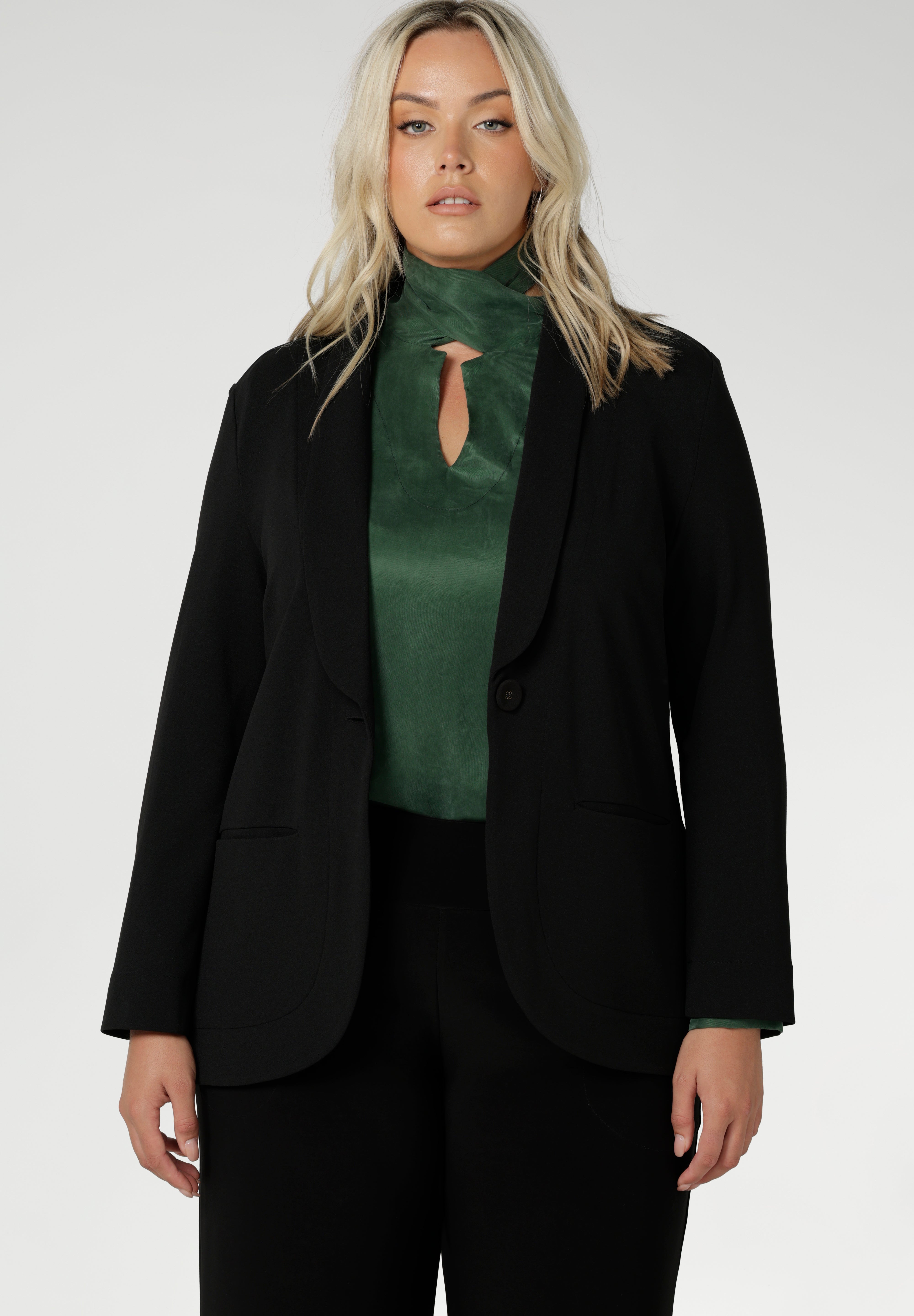 Crafted from suede touch Tencel that has a luxurious feel and drape. Proudly made in Australia in sizes 8-24. The Matisse Shirt in Deep Green is a pull-on style with a tie neckline, crafted from soft, fluid fabric. Blouson sleeves and buttoned cuffs add a polished finish. Matisse is a semi-fitted pull on style V-neckline shirt with extended neck ties, back pleats and bishop sleeves.